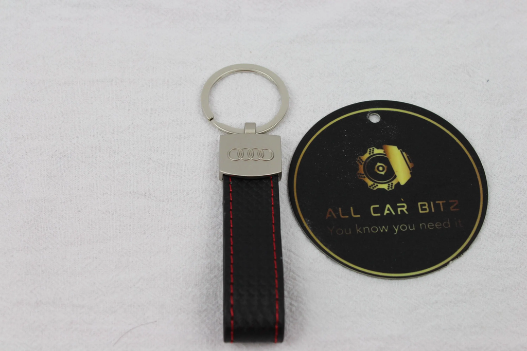 Audi Keychains: Silver Audi Logo with leather strap