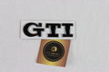 Volkswagen black and chrome GTI logo badge