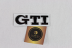 Volkswagen black and chrome GTI logo badge